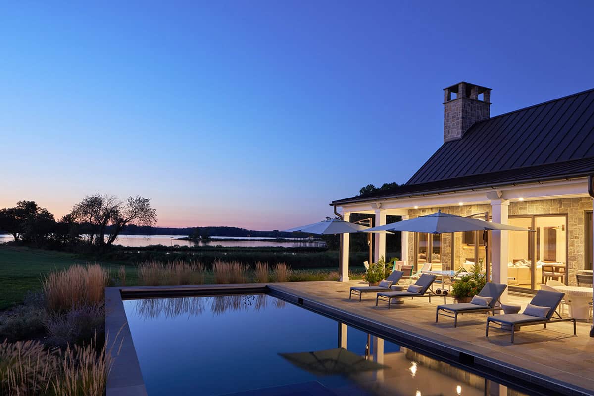 Rear terrace with swimming pool and outdoor entertaining area overlooking Tred Avon River Maryland