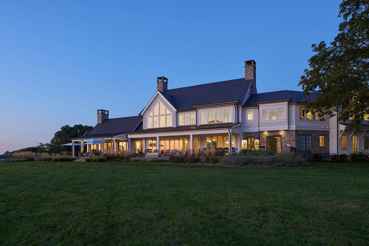 Contemporary rear elevation of Eastern Shore waterfront home at dusk