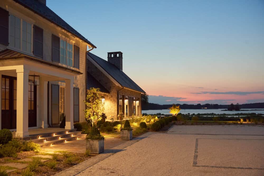 contemporary waterfront home exterior at dusk