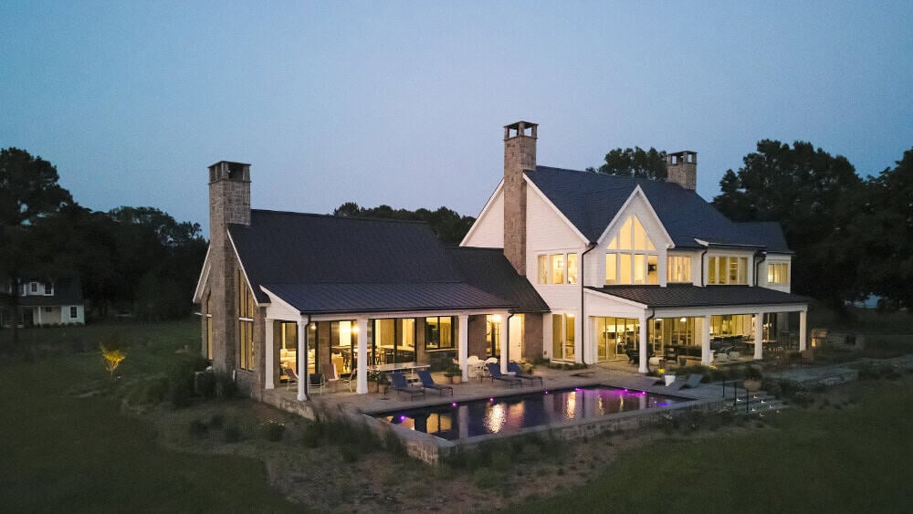 Waterfront outdoor living space with pool and patio at Eastern Shore Maryland home