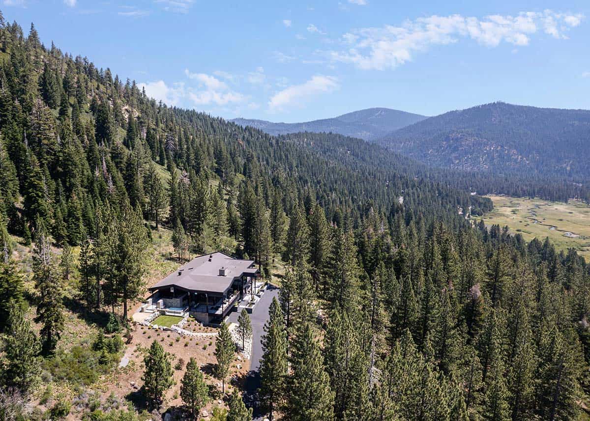 Aerial view of modern mountain home nestled in pine forest, Olympic Valley, CA