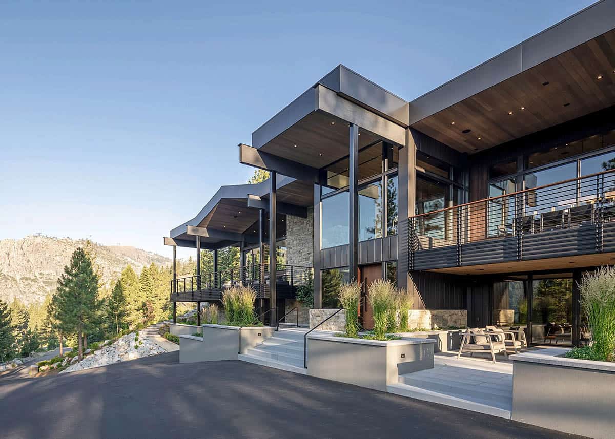 Side exterior of ski retreat at golden hour with cantilevered roof overhangs