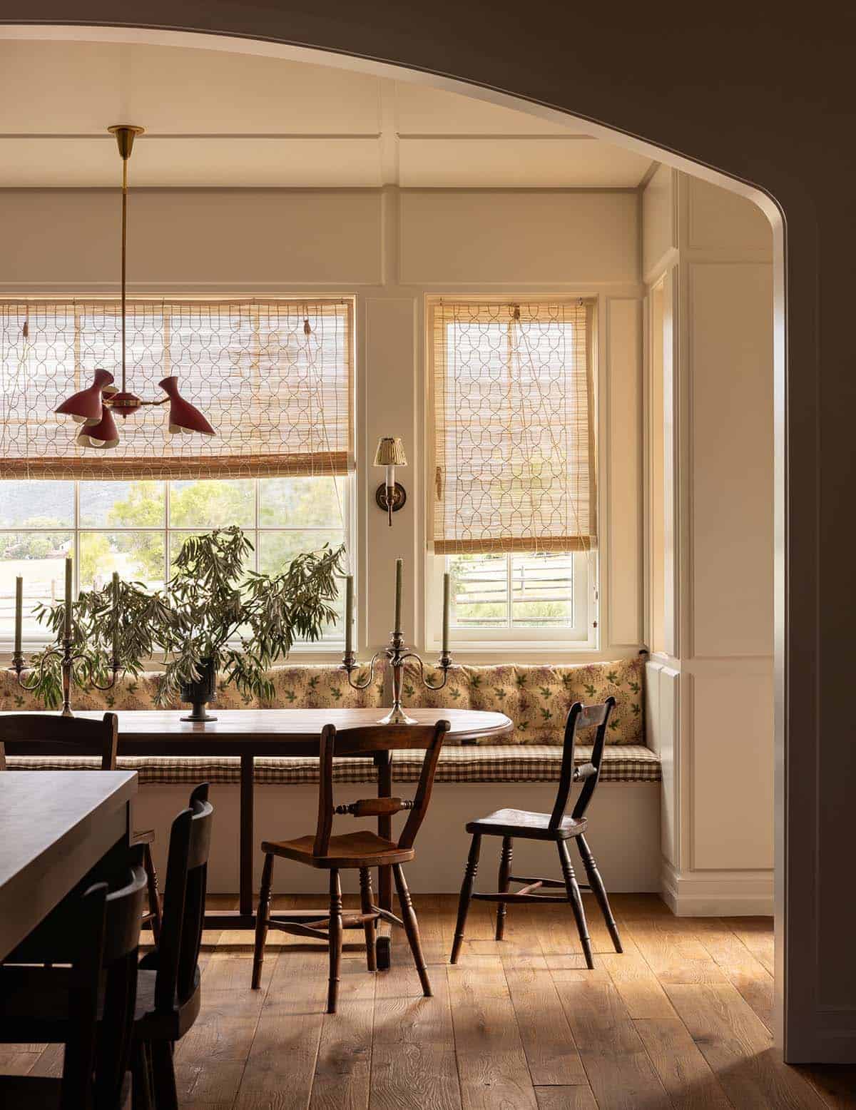 breakfast nook with floral window seat and antique table, Colorado equestrian home