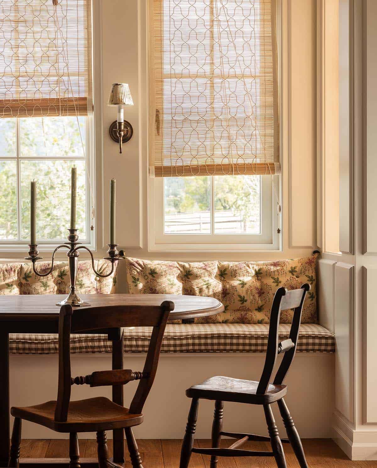 close up of floral window seat banquette with woven shades, Colorado equestrian home
