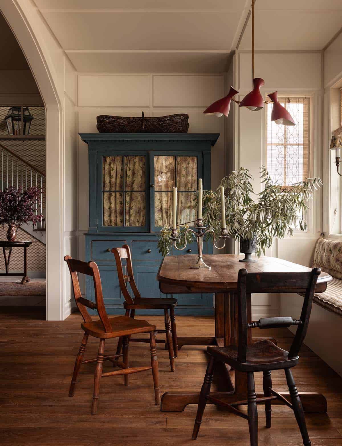 dining room with antique blue hutch and red pendant light, Colorado equestrian home