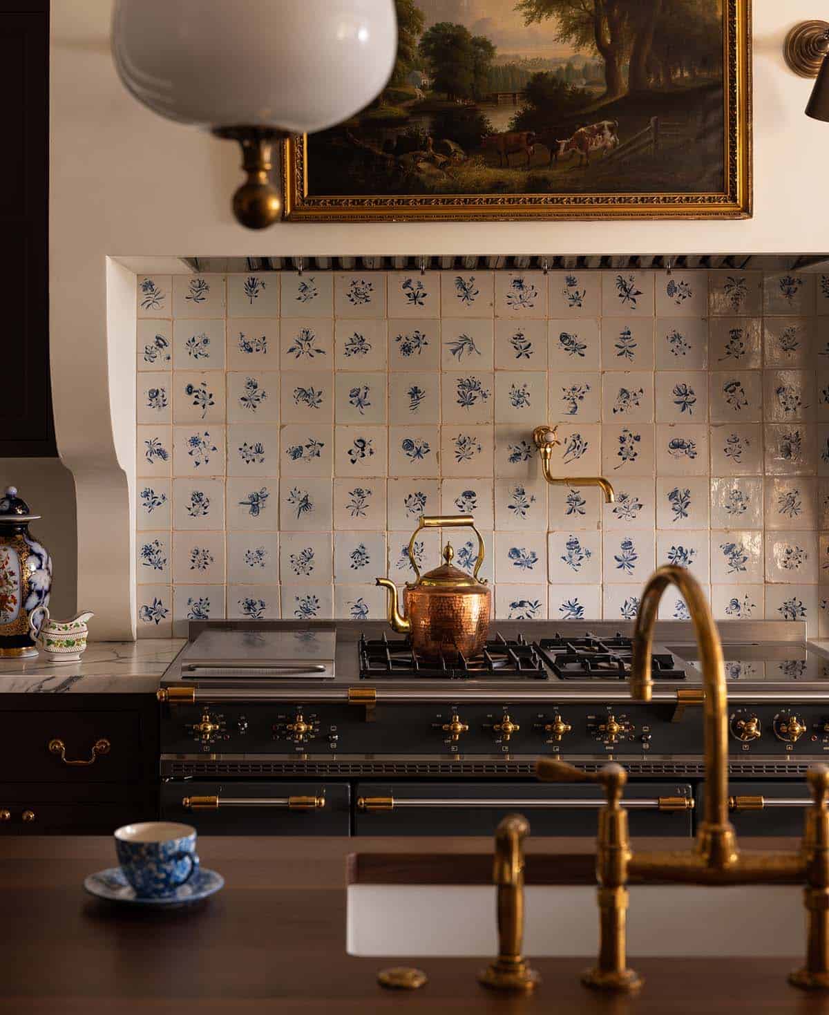 close up of Delft tile backsplash and La Cornue range with brass fittings, Colorado equestrian home