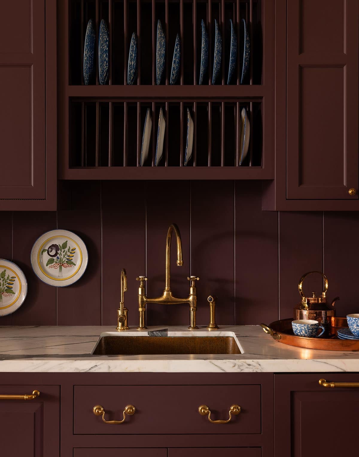 kitchen sink detail with brass bridge faucet and built-in plate rack, Colorado equestrian home