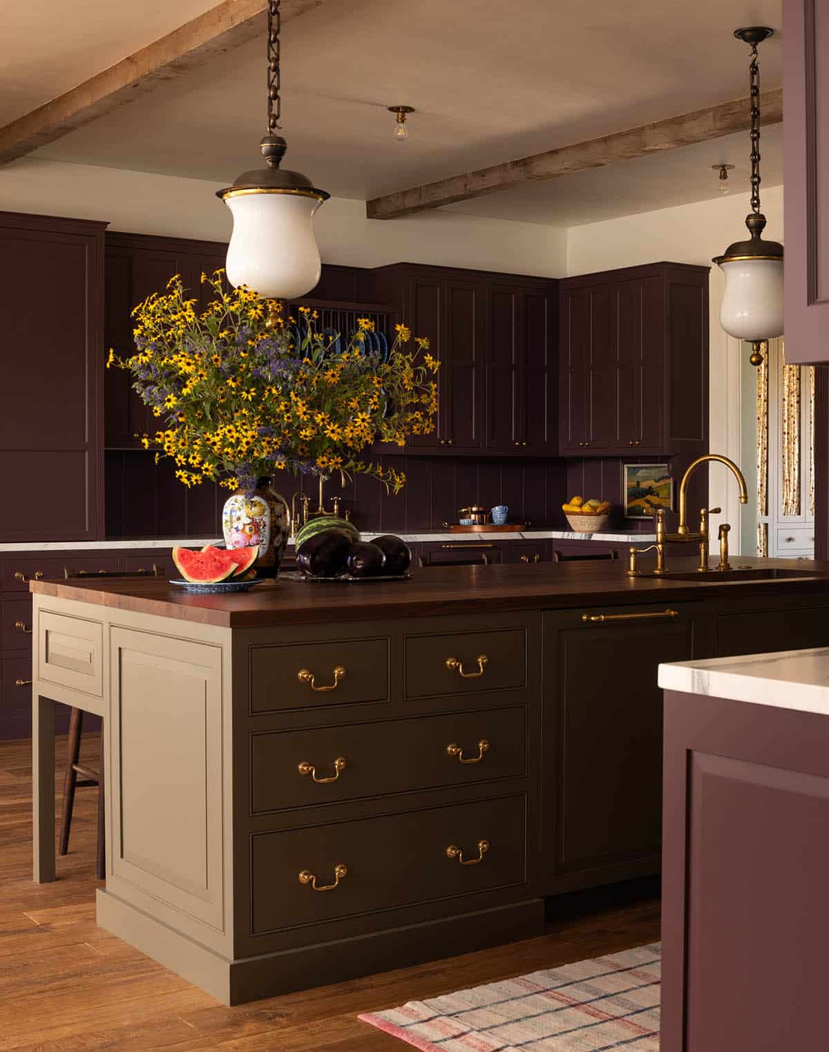 kitchen island with walnut countertop and plum cabinetry, Colorado equestrian home
