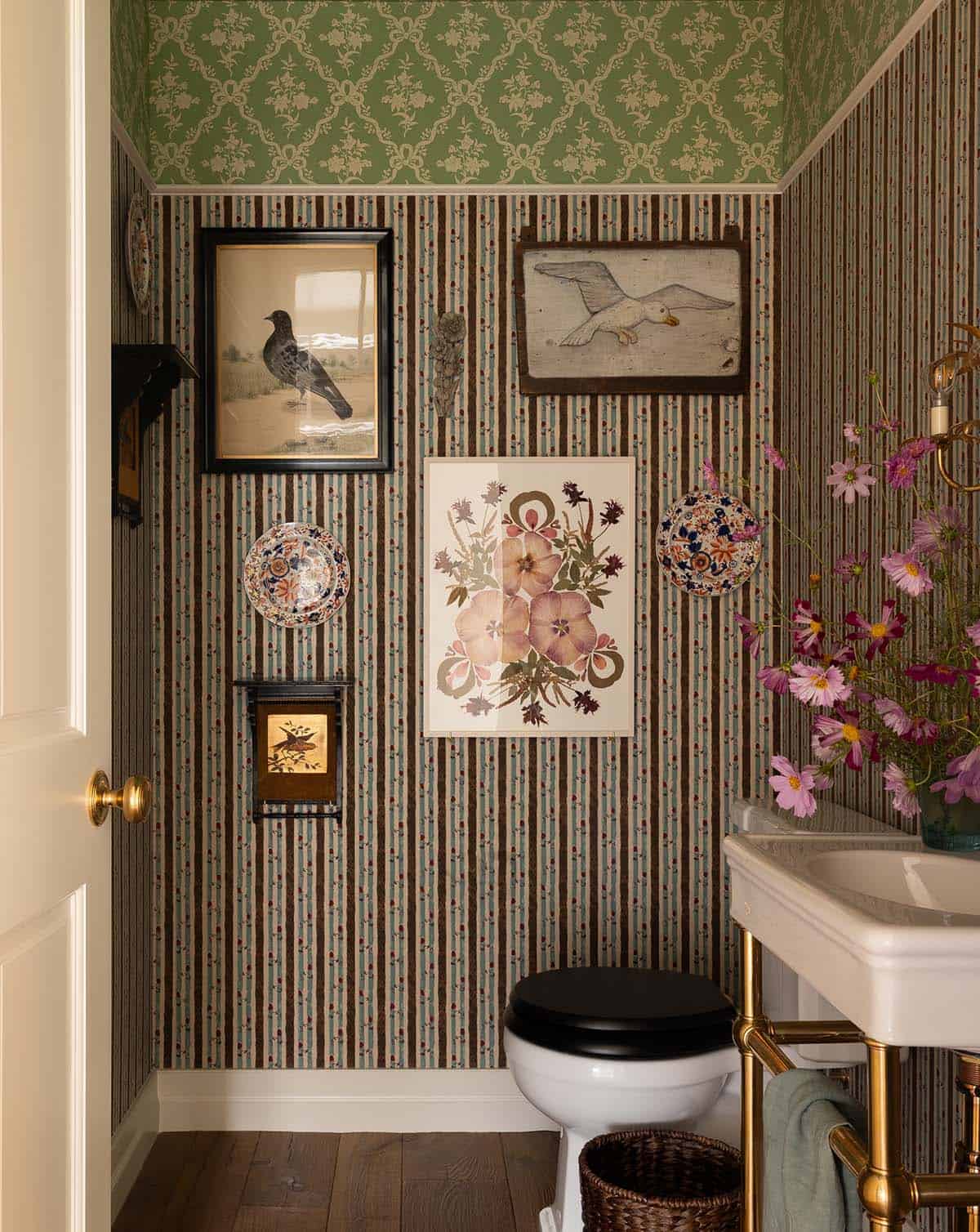 powder room with striped wallpaper and antique bird art gallery wall, Colorado equestrian home