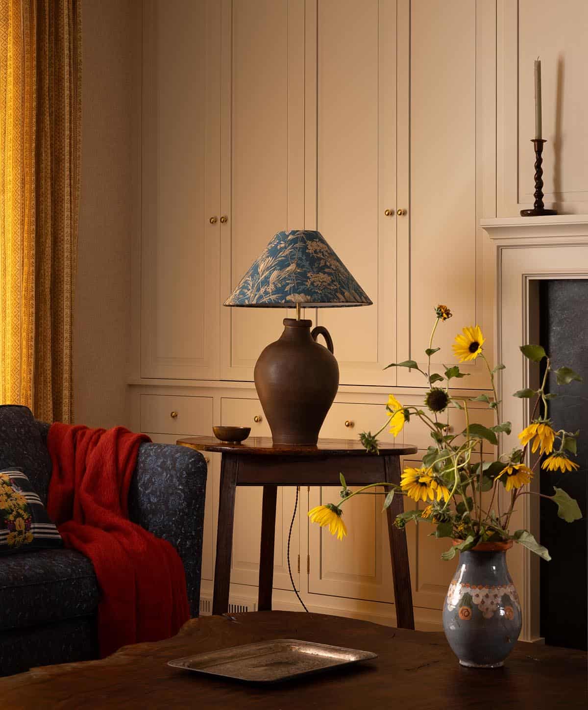 living room corner with antique jug lamp and floral shade, Colorado equestrian home