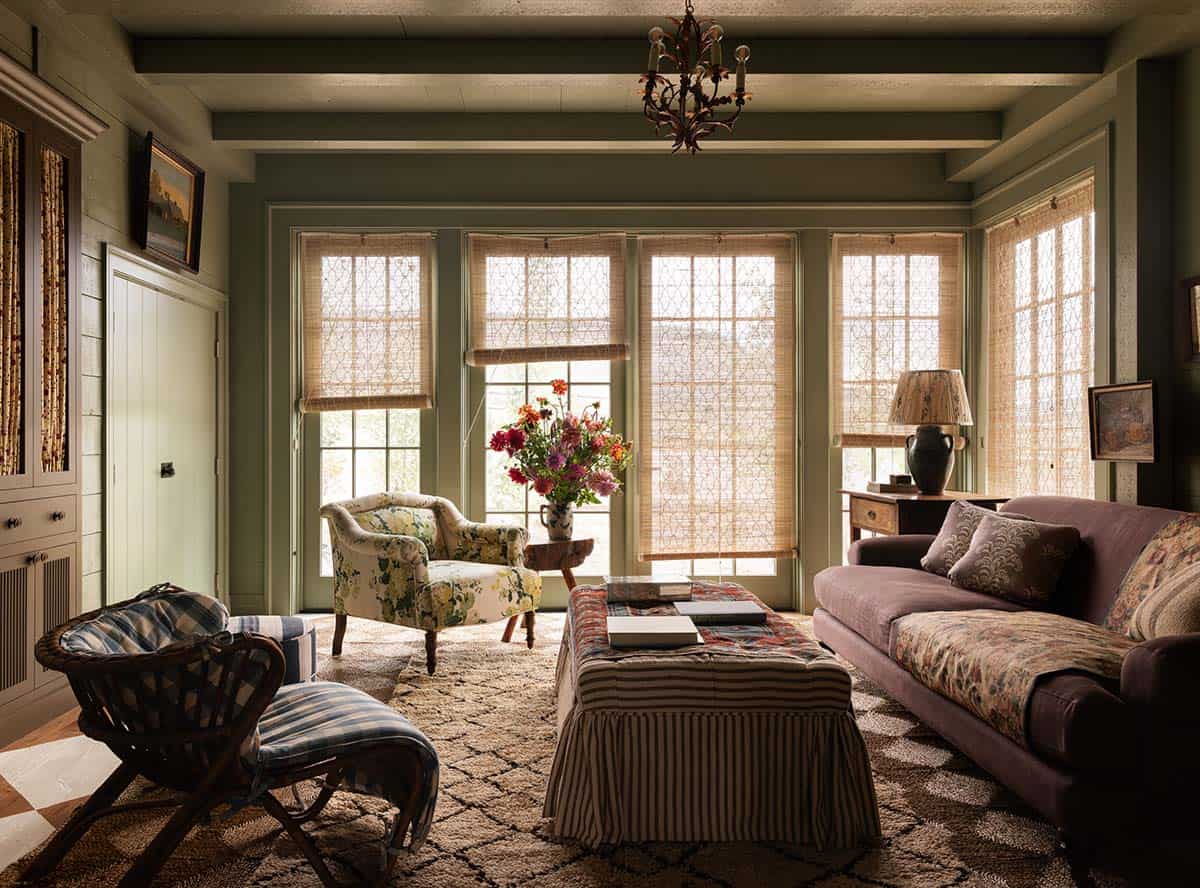 green sitting room with floor-to-ceiling windows and layered textile seating, Colorado equestrian home