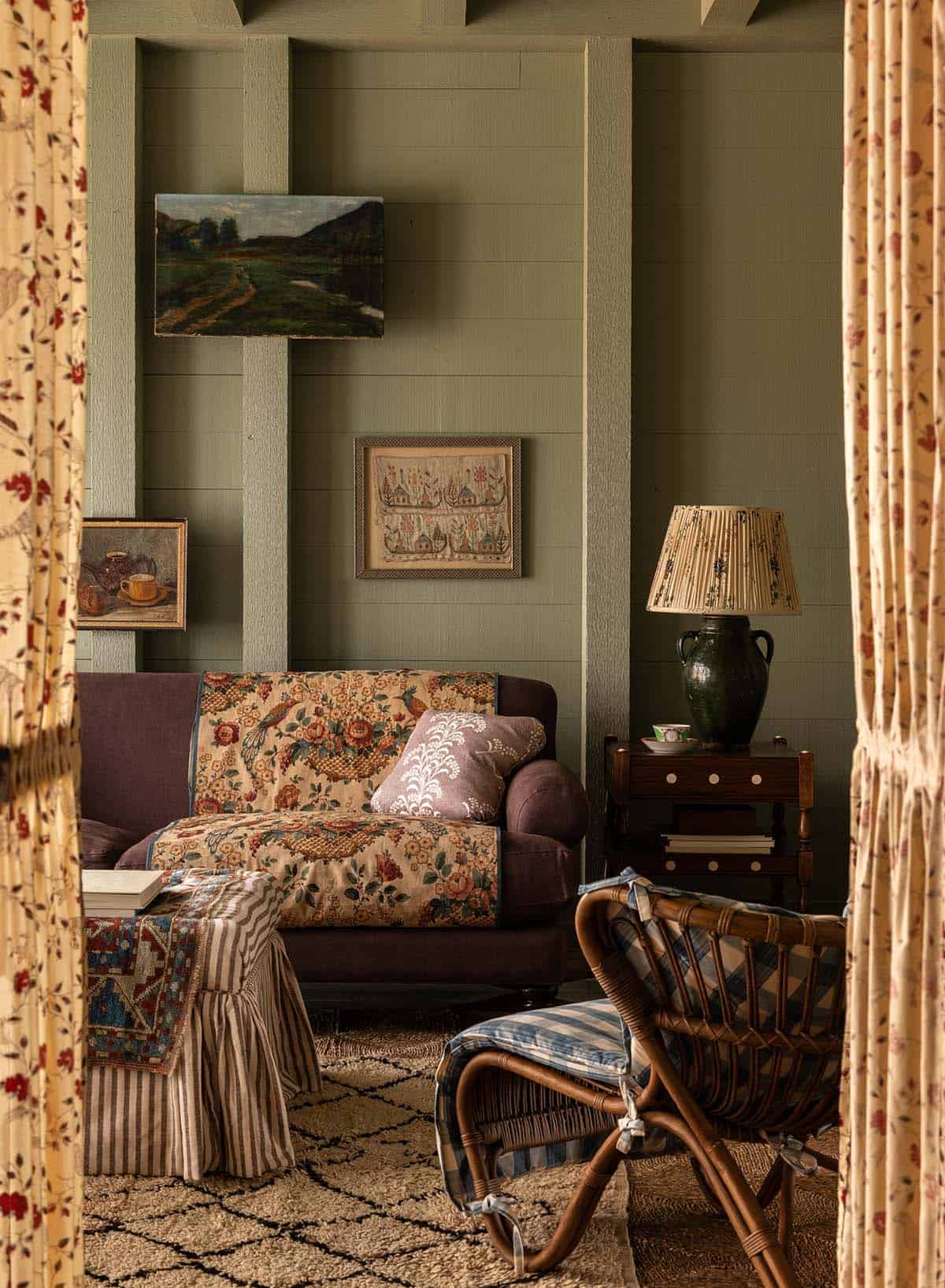 green sitting room detail with layered textiles and antique jug lamp, Colorado equestrian home