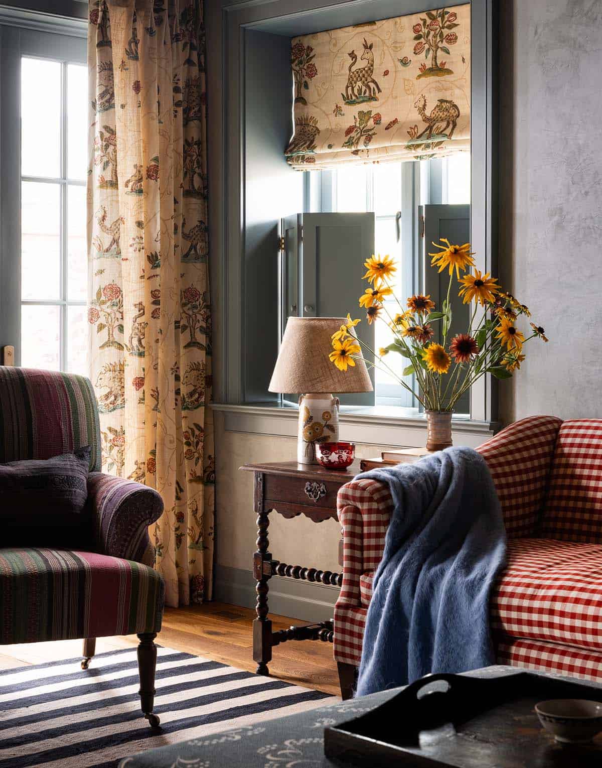 family room corner with gingham sofa and animal print curtains, Colorado equestrian home