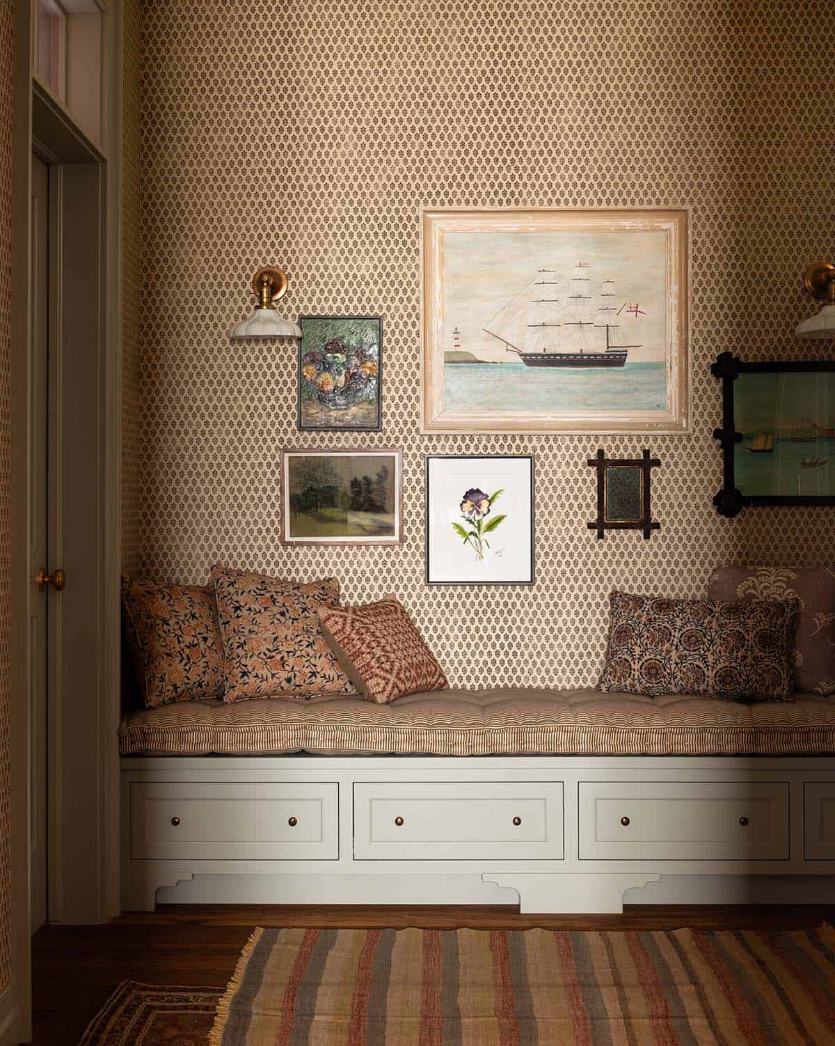 hallway reading nook with built-in storage bench and antique nautical art, Colorado equestrian home