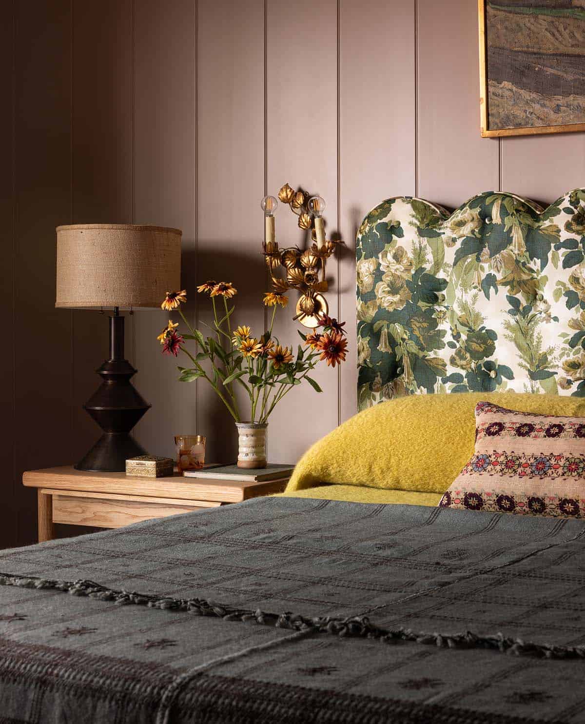 primary bedroom nightstand detail with floral headboard and gold botanical sconce, Colorado equestrian home