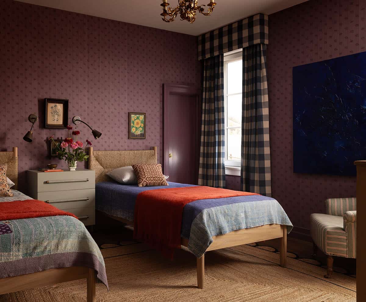 children's bedroom with twin beds, plum wallpaper, and buffalo check curtains, Colorado equestrian home