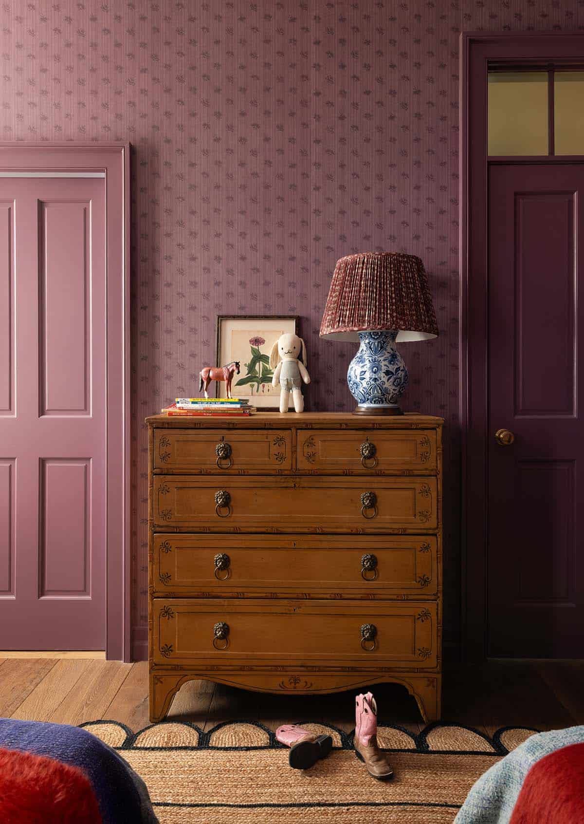 children's bedroom detail with antique pine dresser, toy horse, and blue and white lamp, Colorado equestrian home