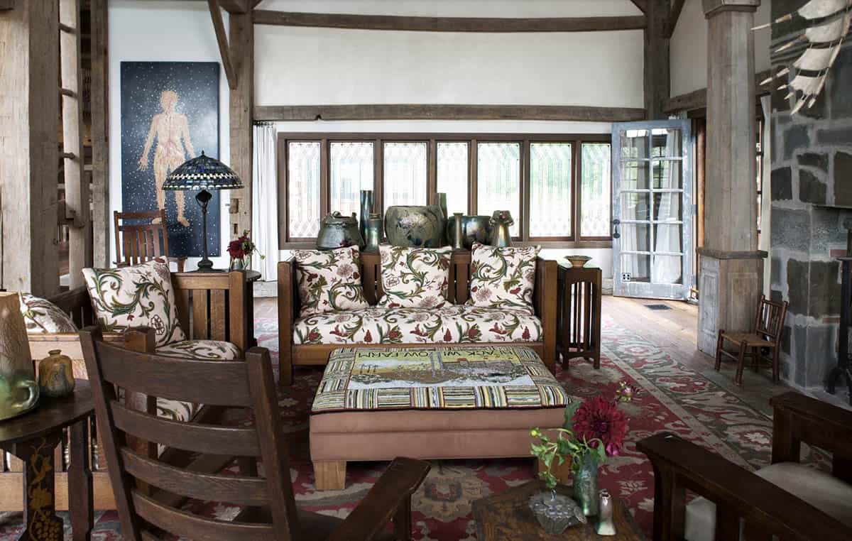Arts and Crafts living room with mission furniture, floral upholstery, and leaded glass windows