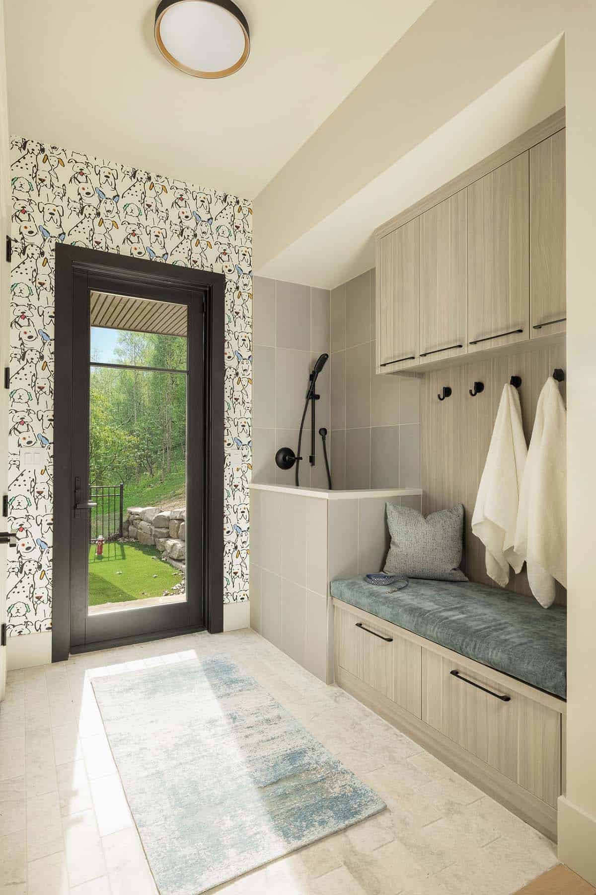 mudroom, dog wash station, playful dog wallpaper, built-in bench, black hardware