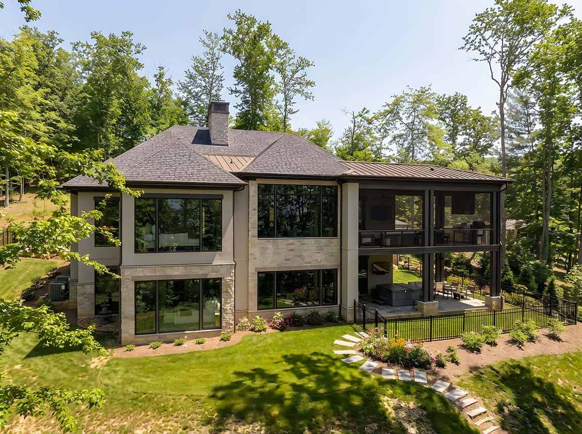 exterior, mountain home, stone and stucco, screened porch, large windows, wooded setting