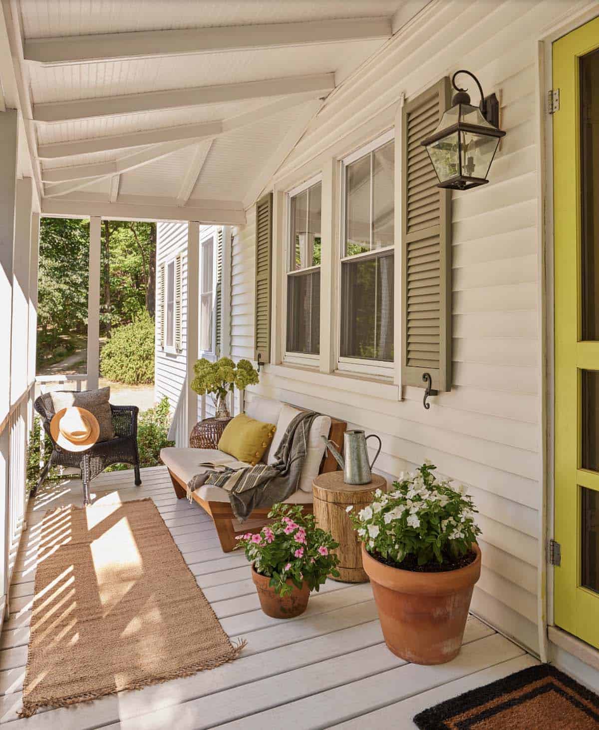 Narrow White Porch With Wood Bench, Jute Runner, and Terracotta Pots