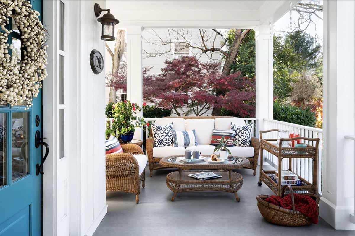 White Porch With Wicker Furniture Set, Teal Door, and Berry Wreath