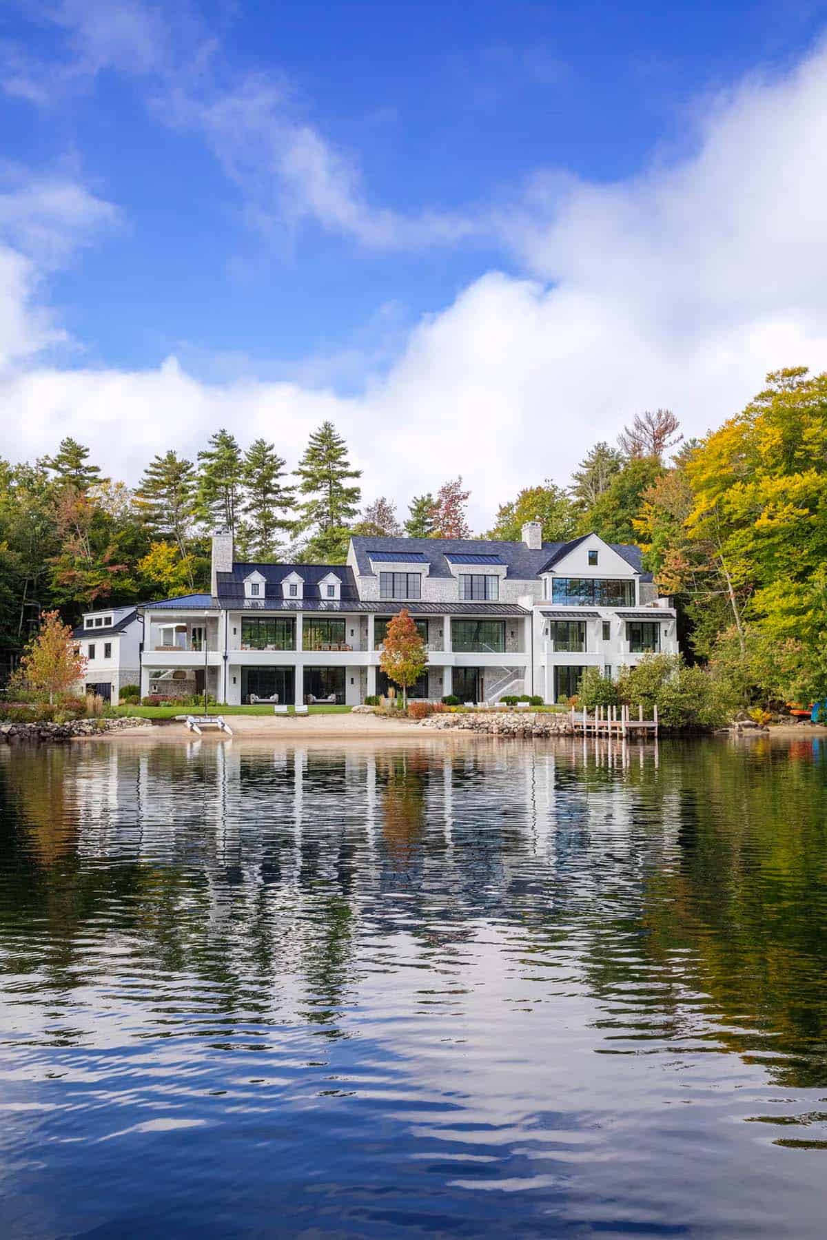Contemporary white lakeside home with multi-level terraces