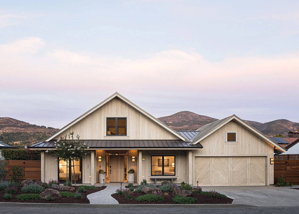 Wine country home exterior with cedar siding and metal roof