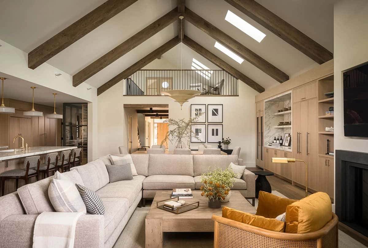 Open plan living room with vaulted ceiling and exposed beams
