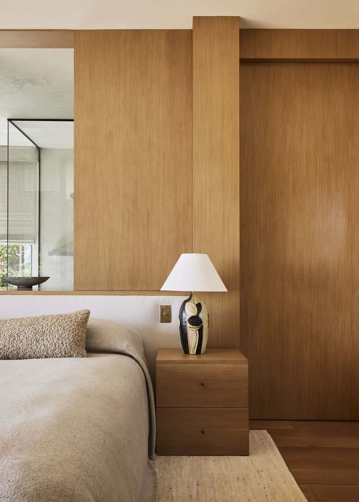 Primary bedroom with wood paneling