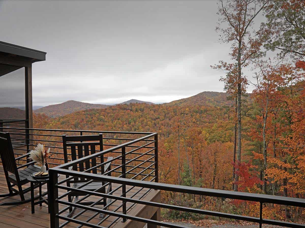 Deck with rocking chairs overlooking autumn mountain foliage in Georgia