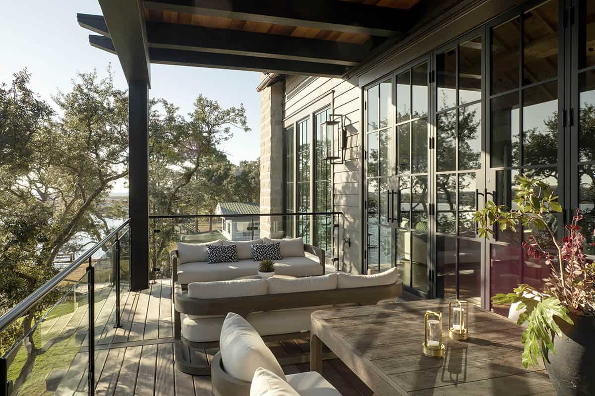 Upper deck with lake views steel frame windows and outdoor seating