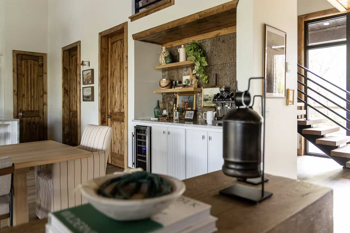 Built-in coffee and bar station with bark-textured backsplash, open shelving, and wine fridge