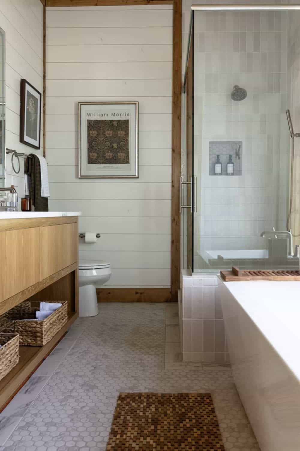 Ensuite bathroom with white shiplap, wood vanity, glass shower, freestanding tub, and William Morris print