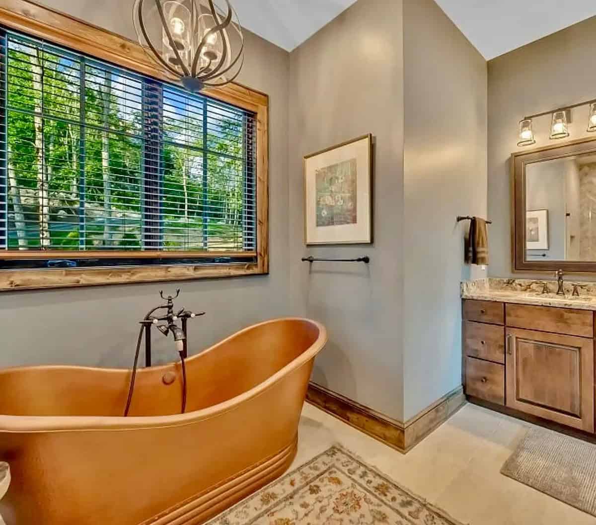 Main bath with a copper tub in front of a large window
