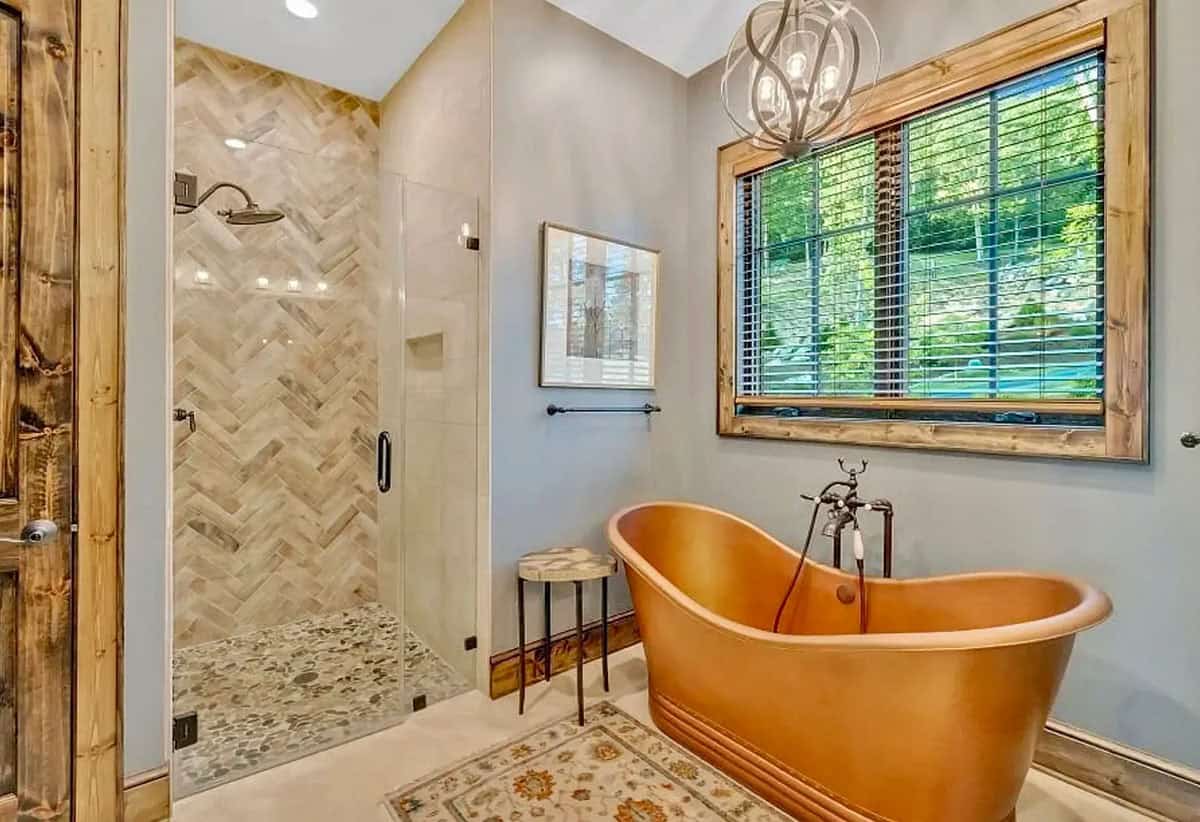 Main bath with a copper tub and tile shower