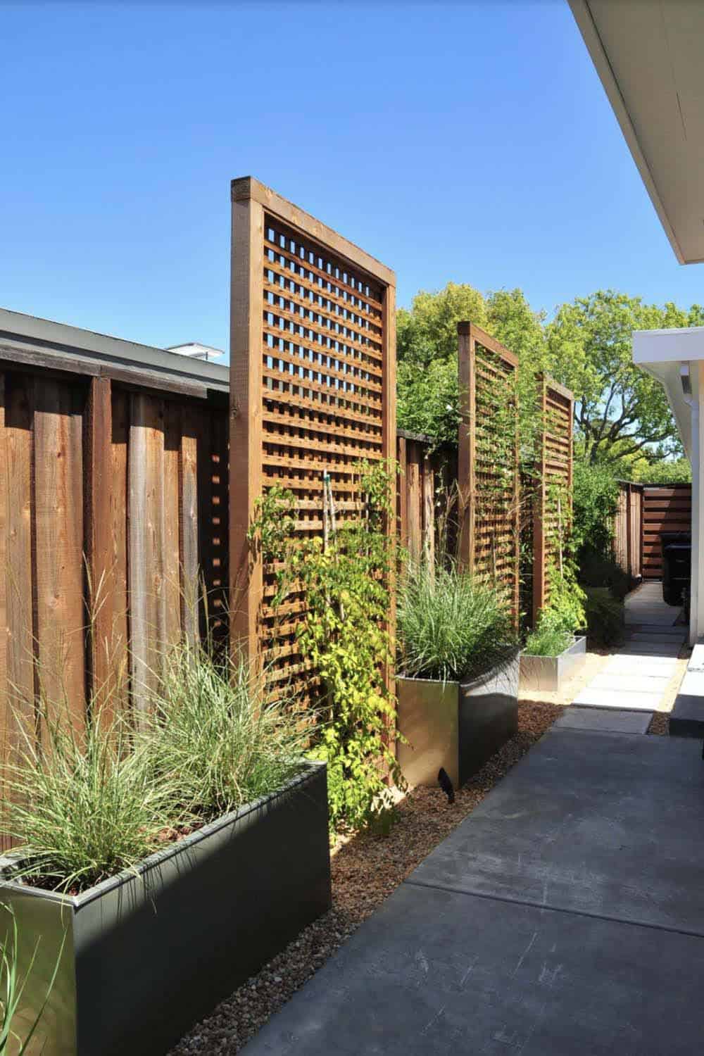 contemporary backyard with square lattice privacy panels