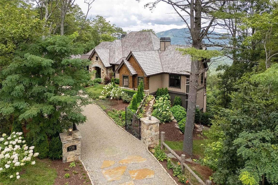 aerial view, cedar shake roof, stone and board-and-batten exterior, gravel driveway, mountain views, North Carolina