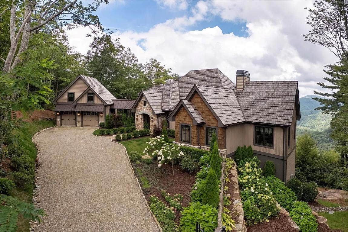front exterior, cedar shake roof, stone facade, attached garage, mountain views, hydrangea landscaping