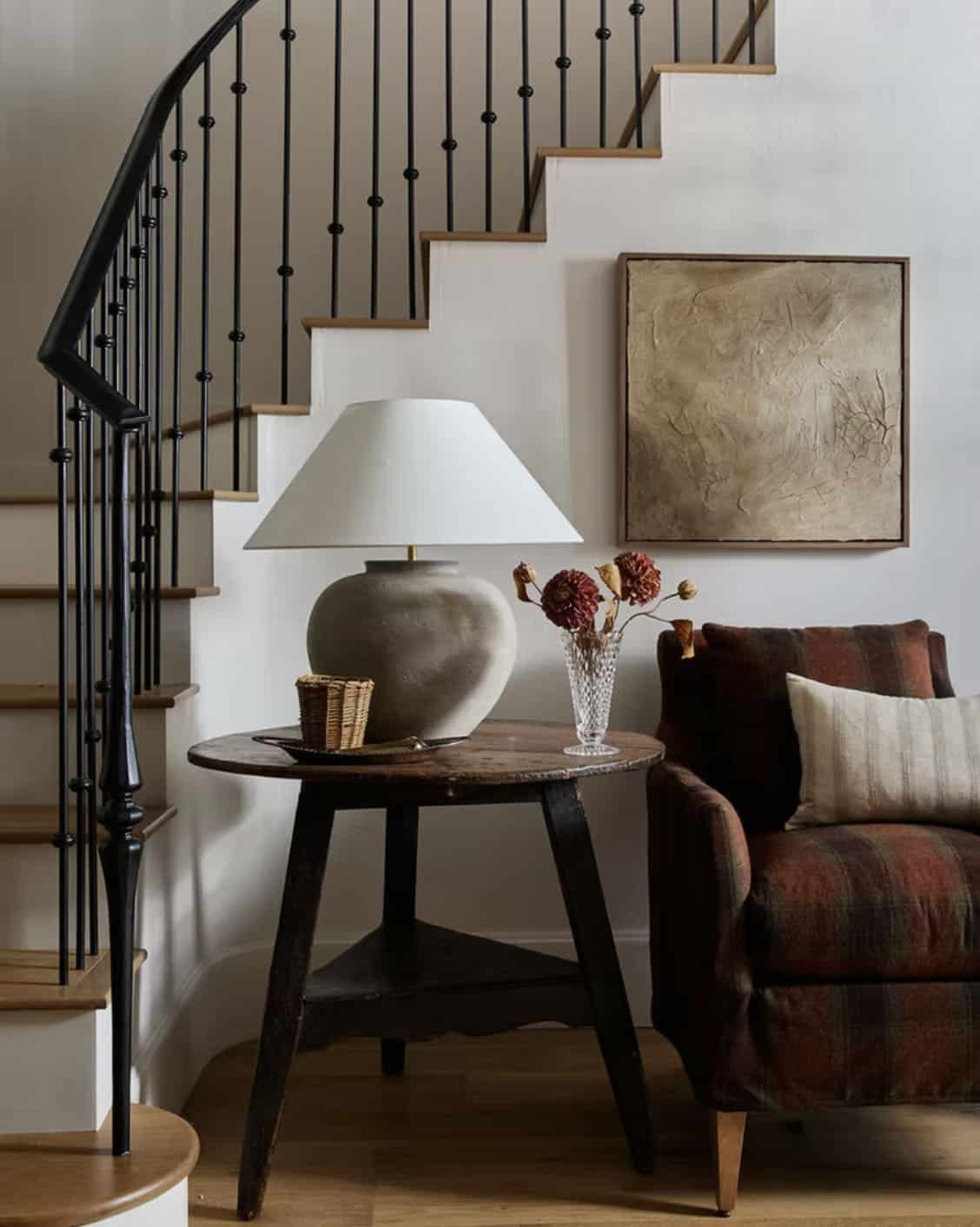 Entryway Vignette with Iron Staircase and Plaid Chair