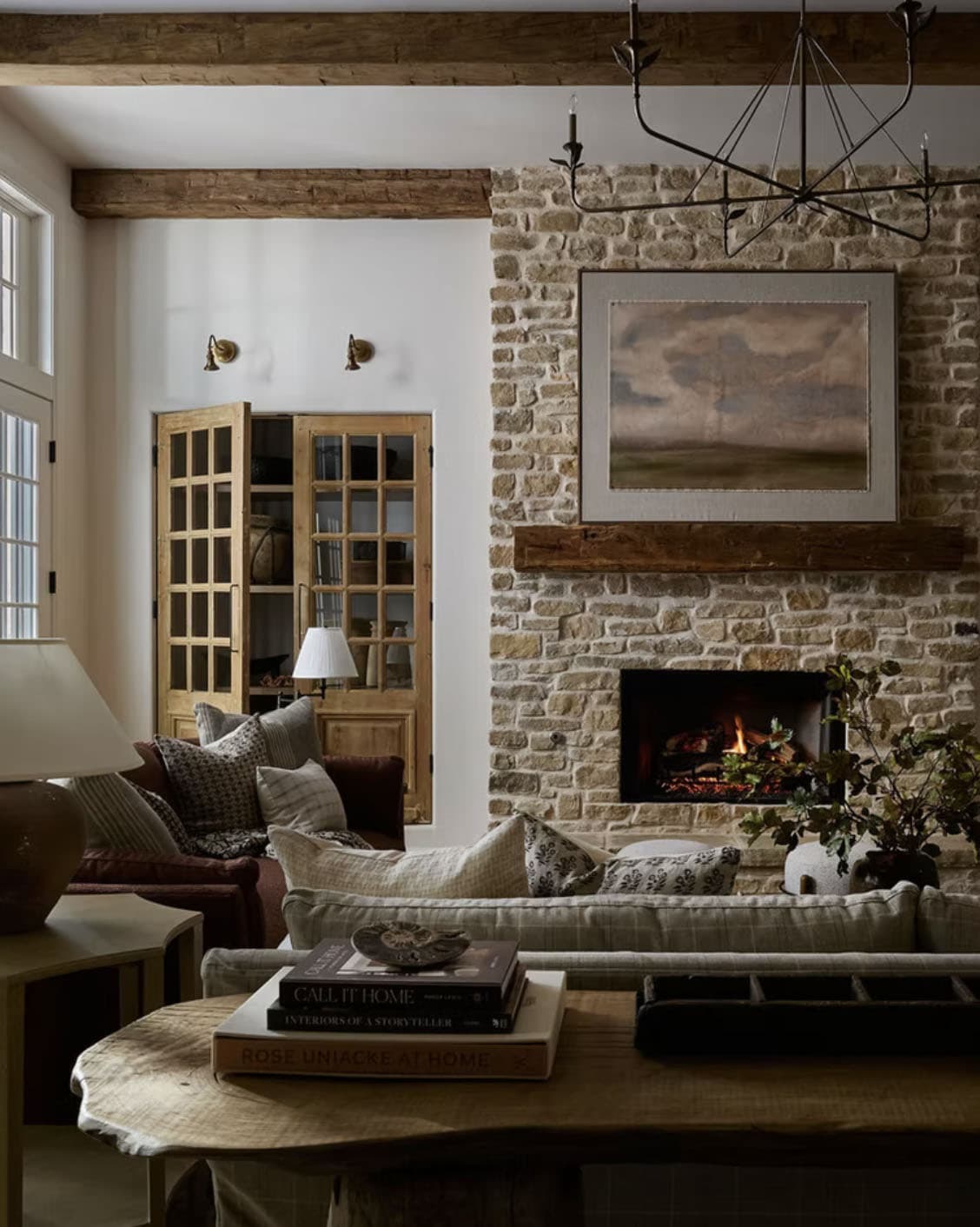 Moody Stone Fireplace Living Room with Reclaimed Beams