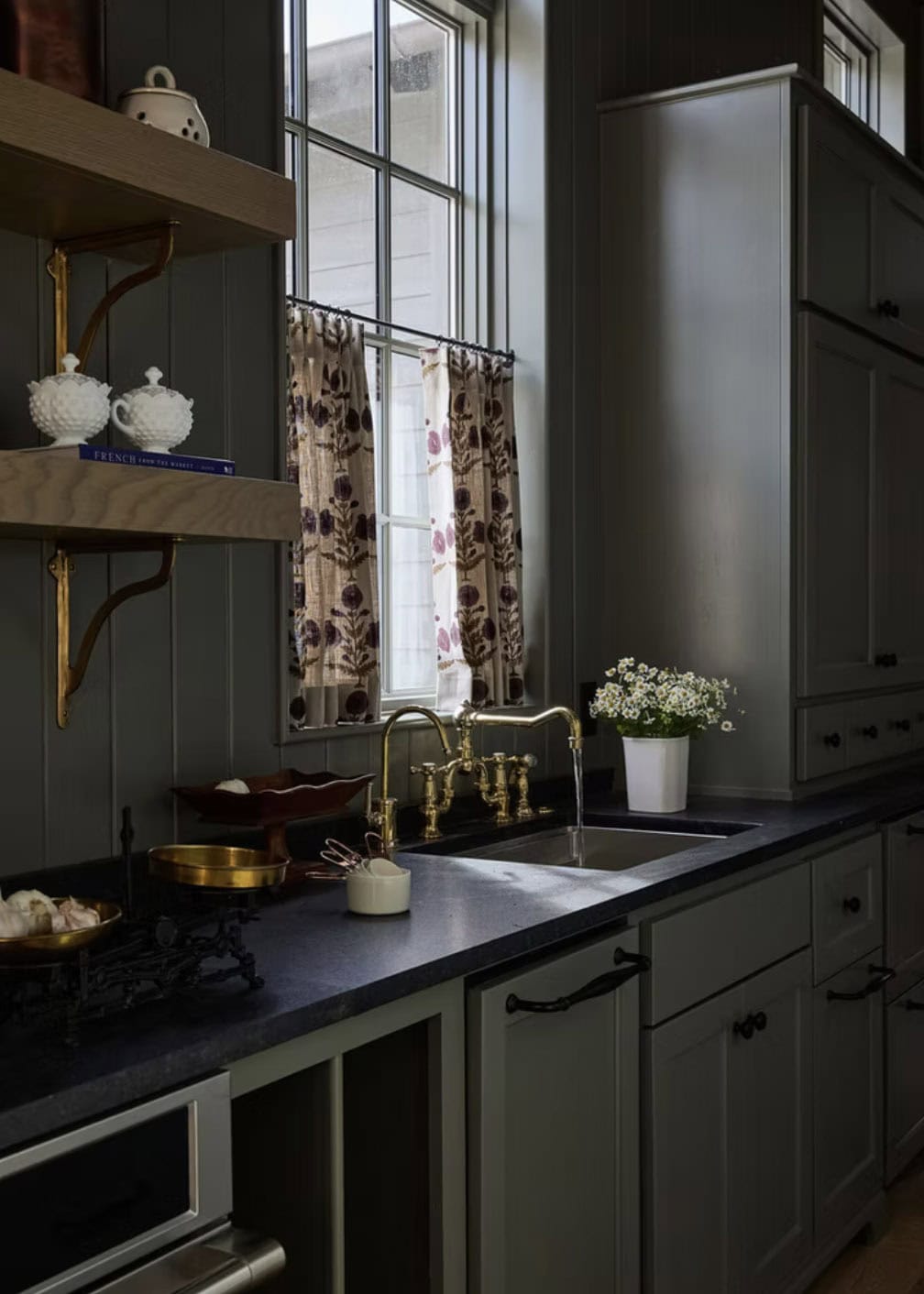 Pantry Sink with Brass Bridge Faucet and Dark Countertops