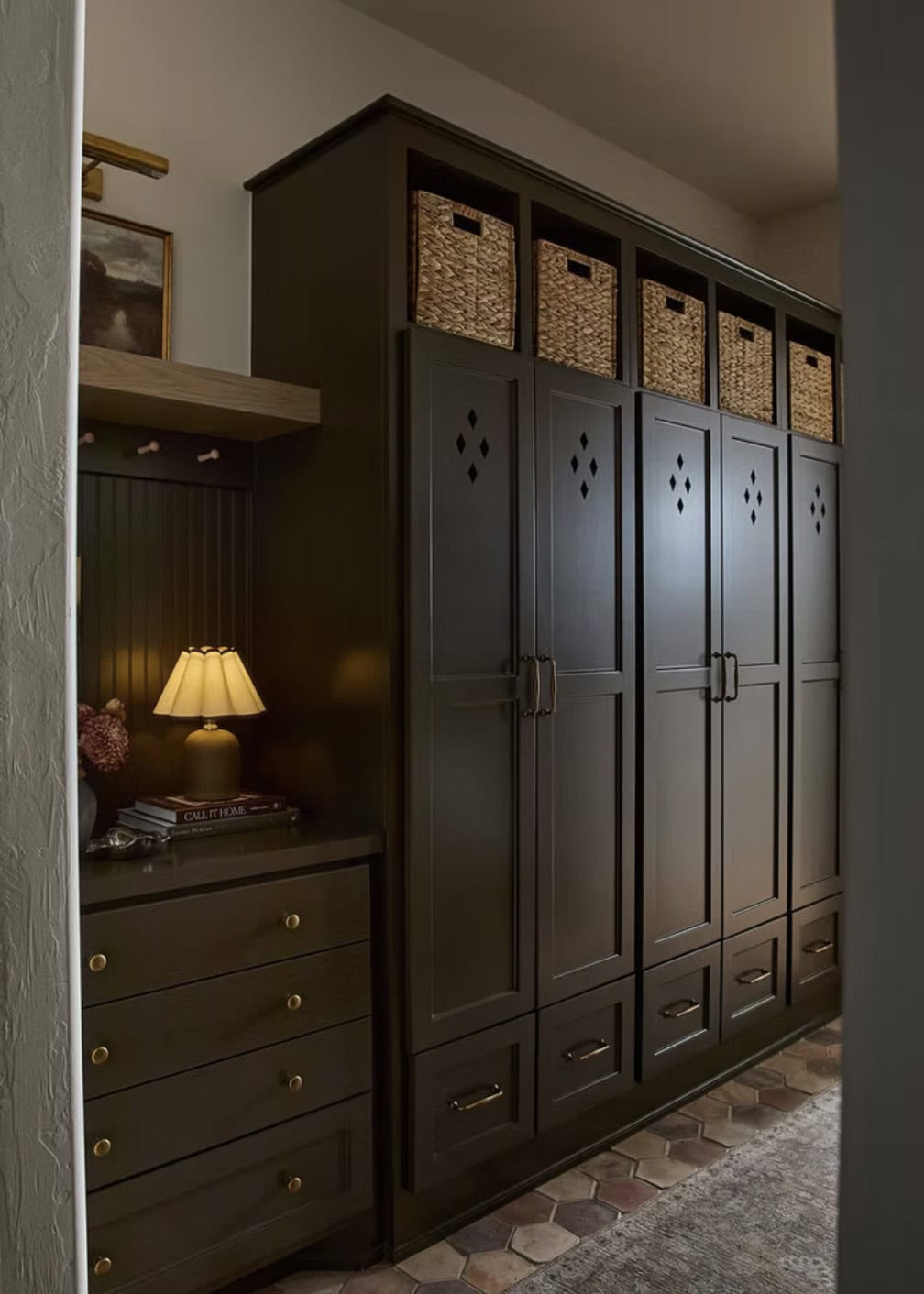 Dark Mudroom Lockers with Woven Baskets and Built-Ins