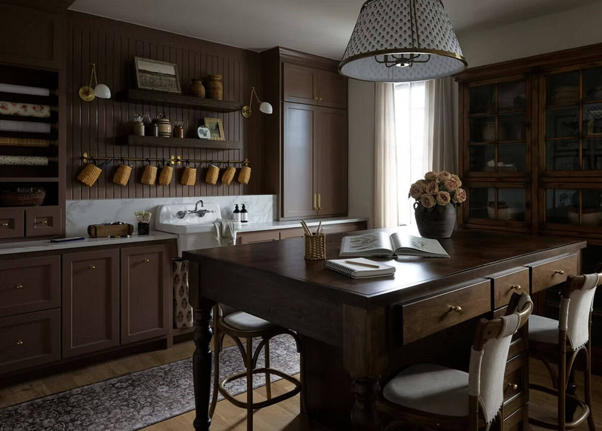 Dark Walnut Craft Room with Wrapping Paper Storage and Island