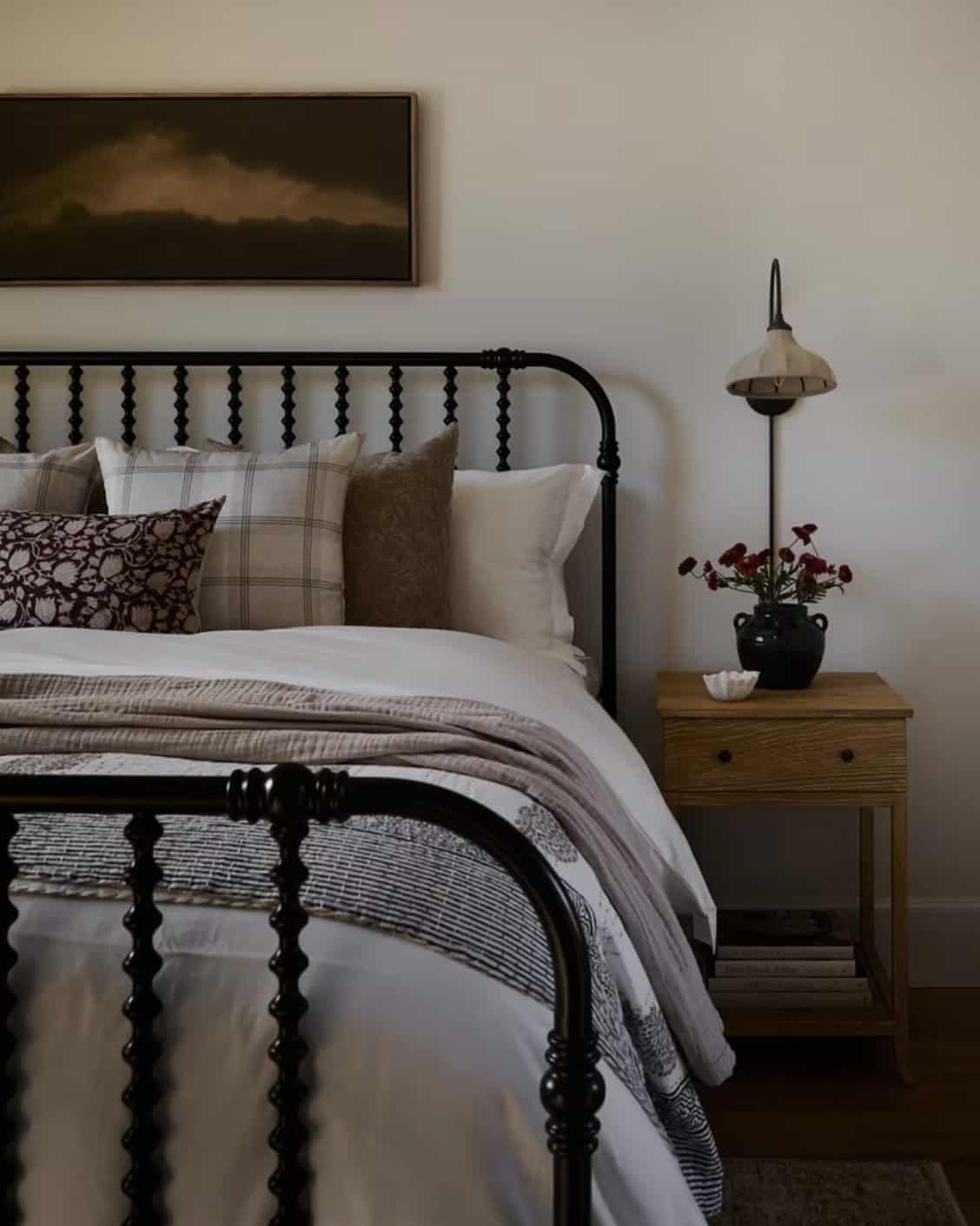 Black Iron Spindle Bed with Plaid Layered Bedding