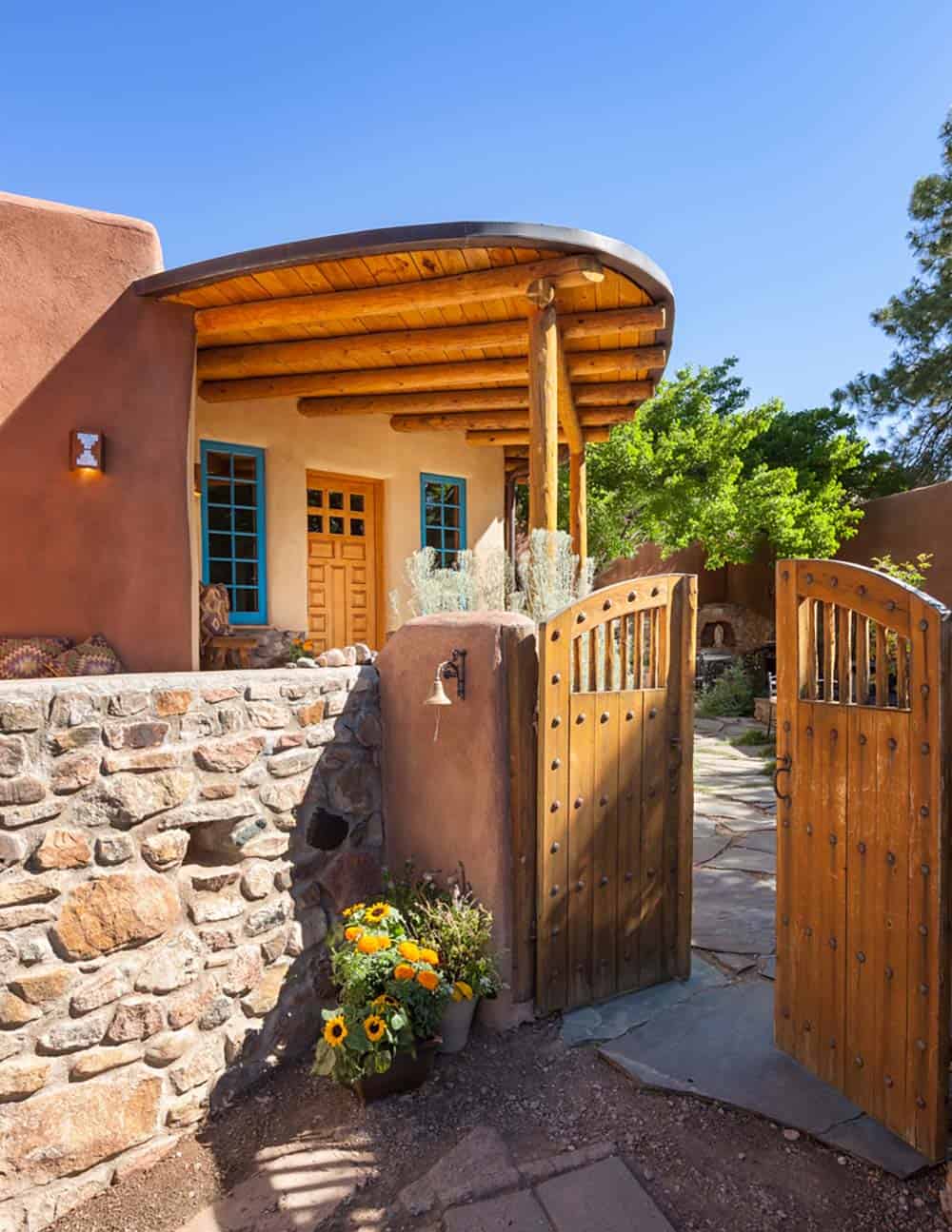 santa fe style home exterior with a gate