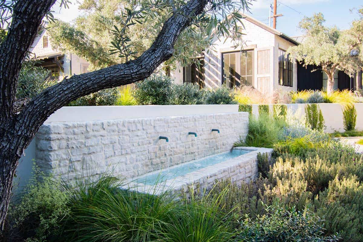 exterior, stone water feature wall, Mediterranean landscaping, olive trees, Encinitas California