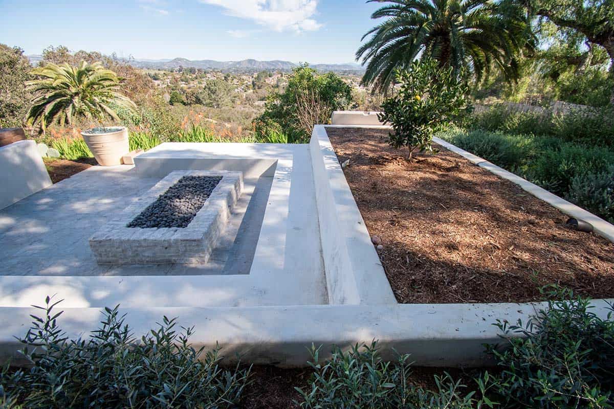 modern coastal property with a fire pit