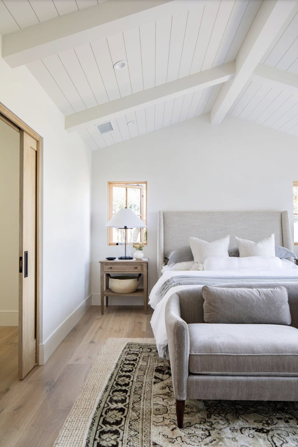 contemporary coastal style bedroom with french doors