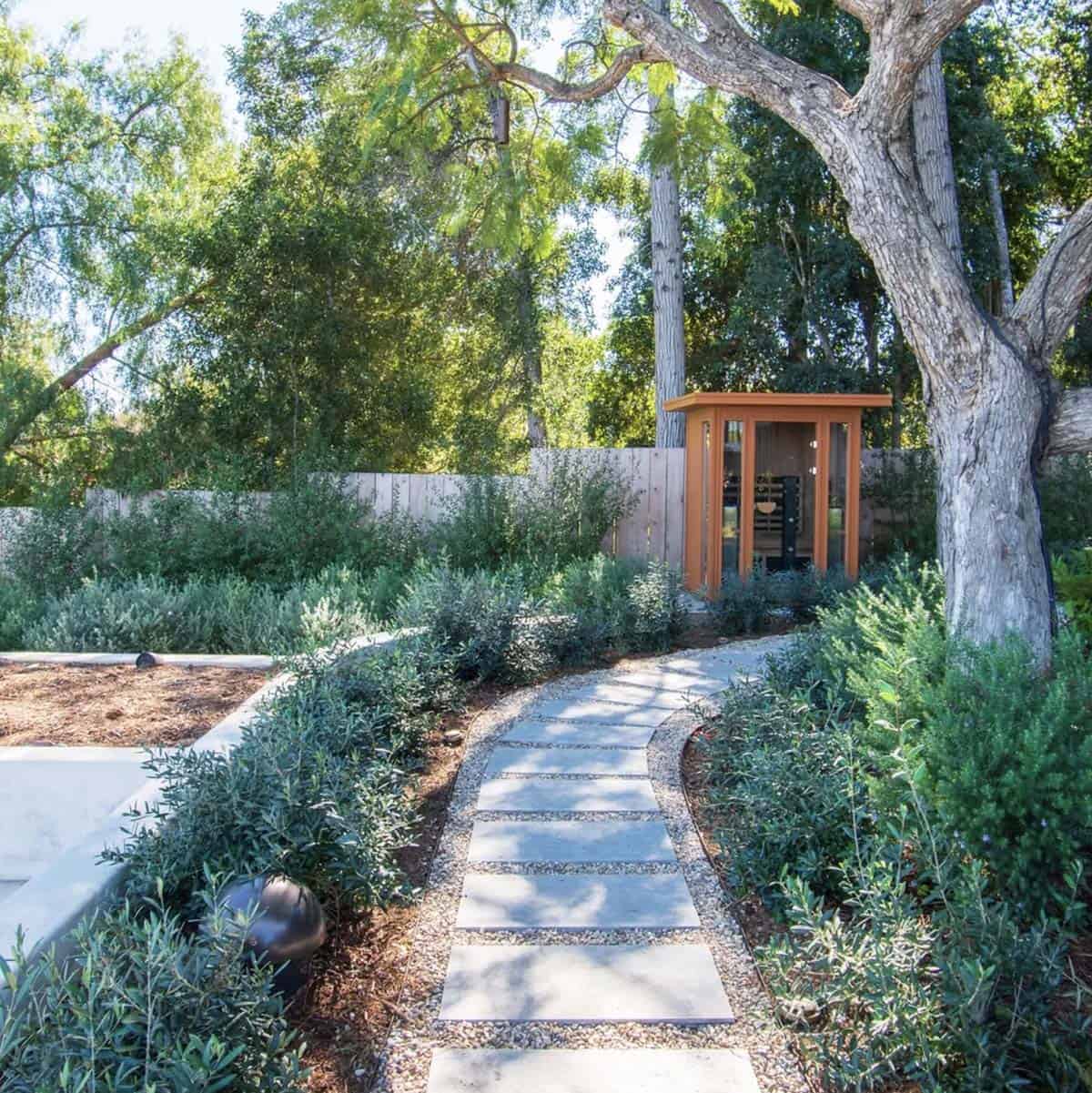 traditional coastal home garden pathway to a sauna